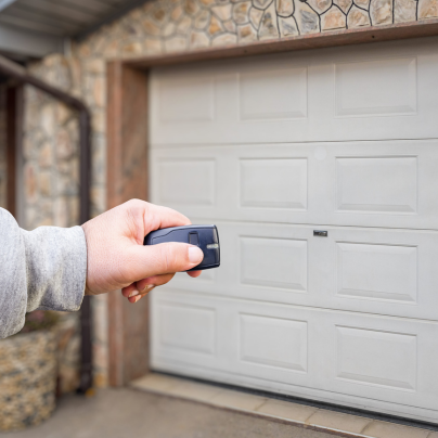Springfield security key fob pointing to a garage door